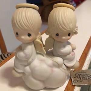 Vintage 1979 precious moments pastel-color Angels sitting on a cloud.